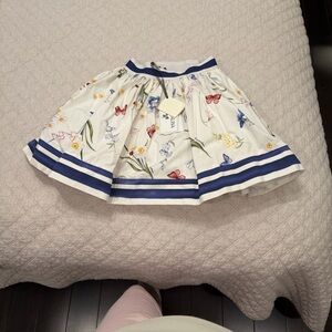 Girls MonnaLisa White Floral Skirt with Navy Trim